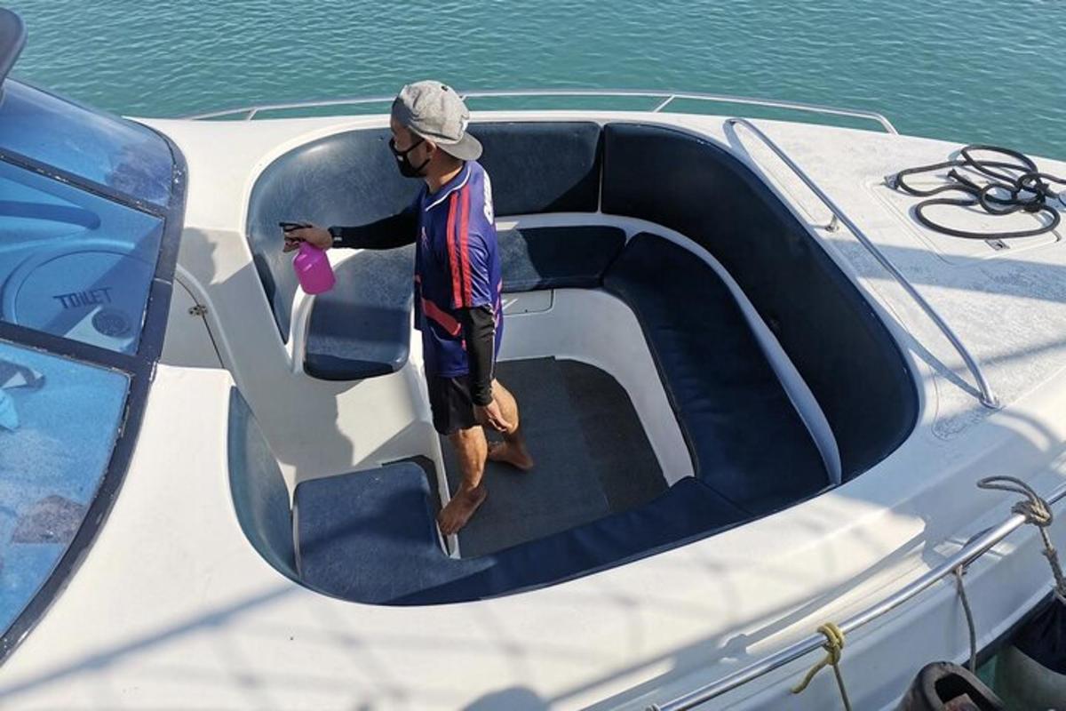 a man standing on the door of a boat