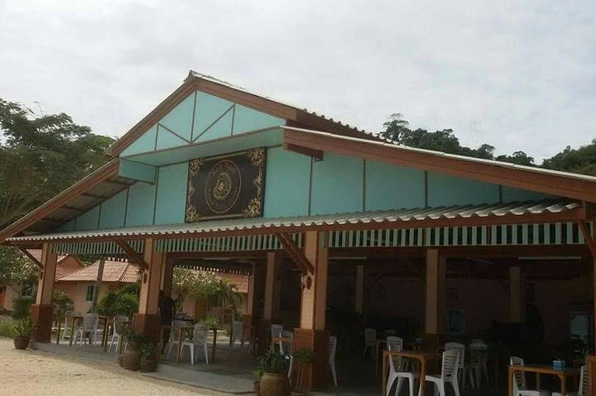 a building with tables and chairs in front of it