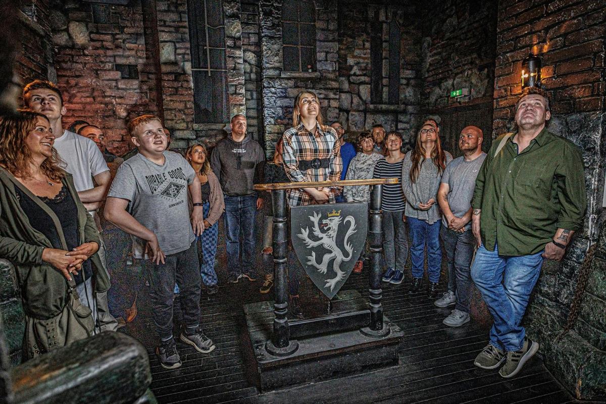 a group of people standing in a room