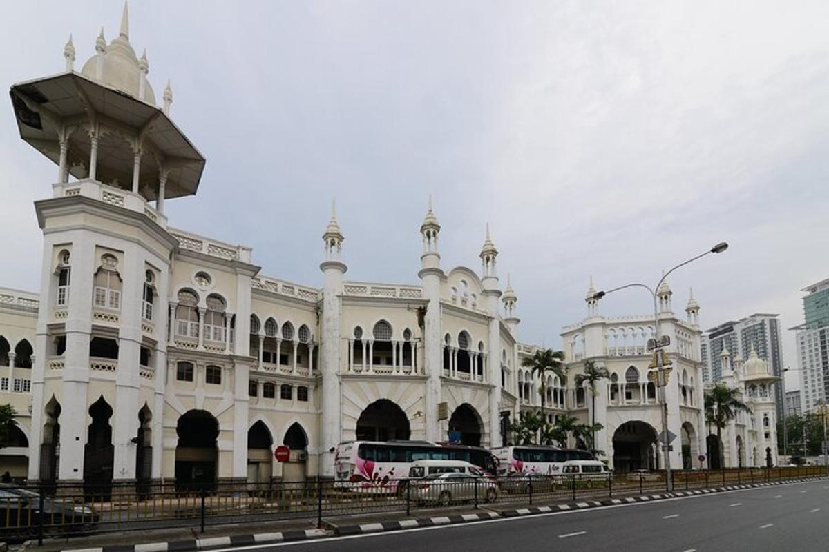 a large white building with cars parked in front of it