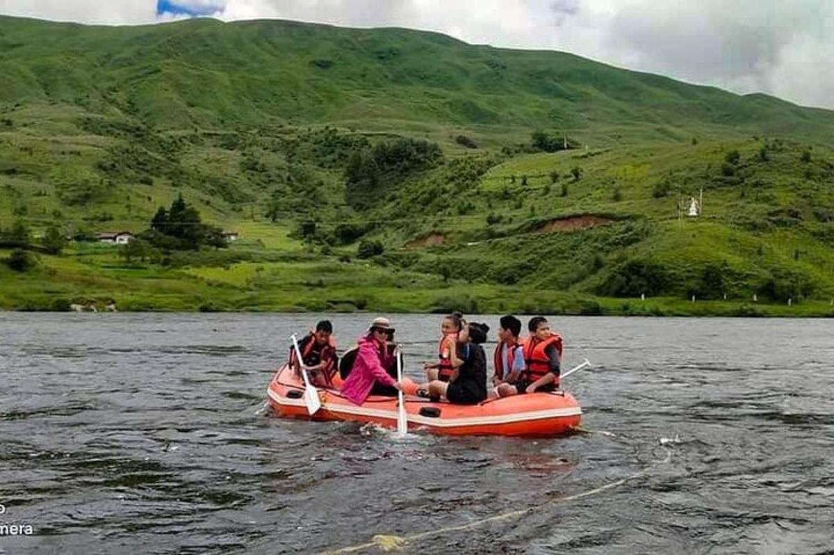 a group of people on a boat in the water
