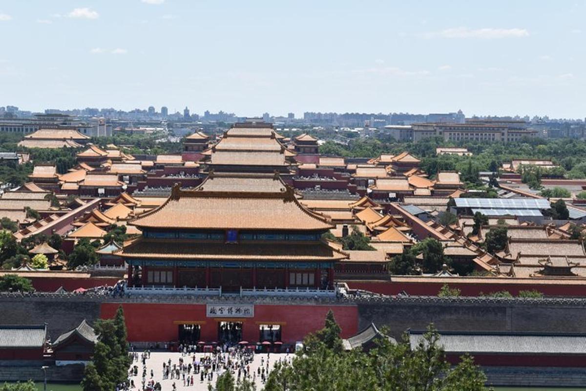 an aerial view of a large building with people walking around it