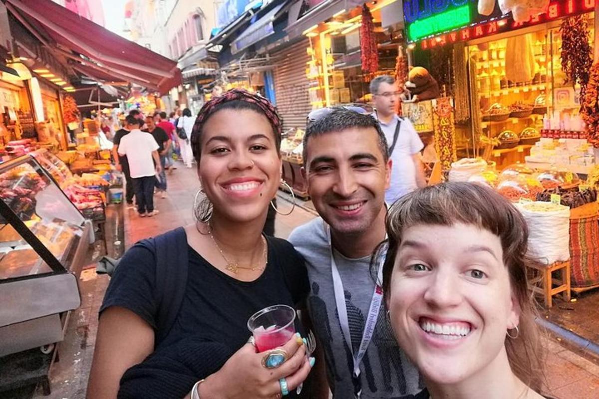 a group of people posing for a picture in a market