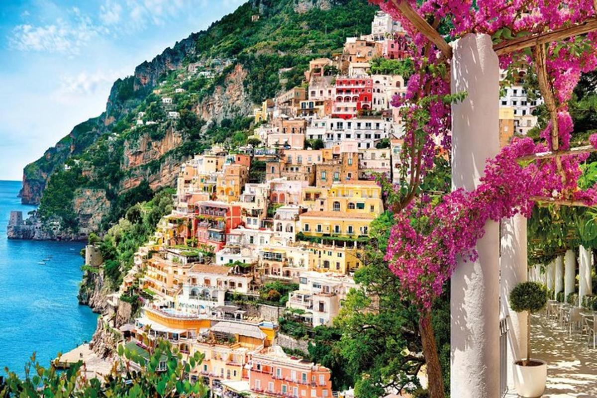 a view of the amalfi coast with pink flowers