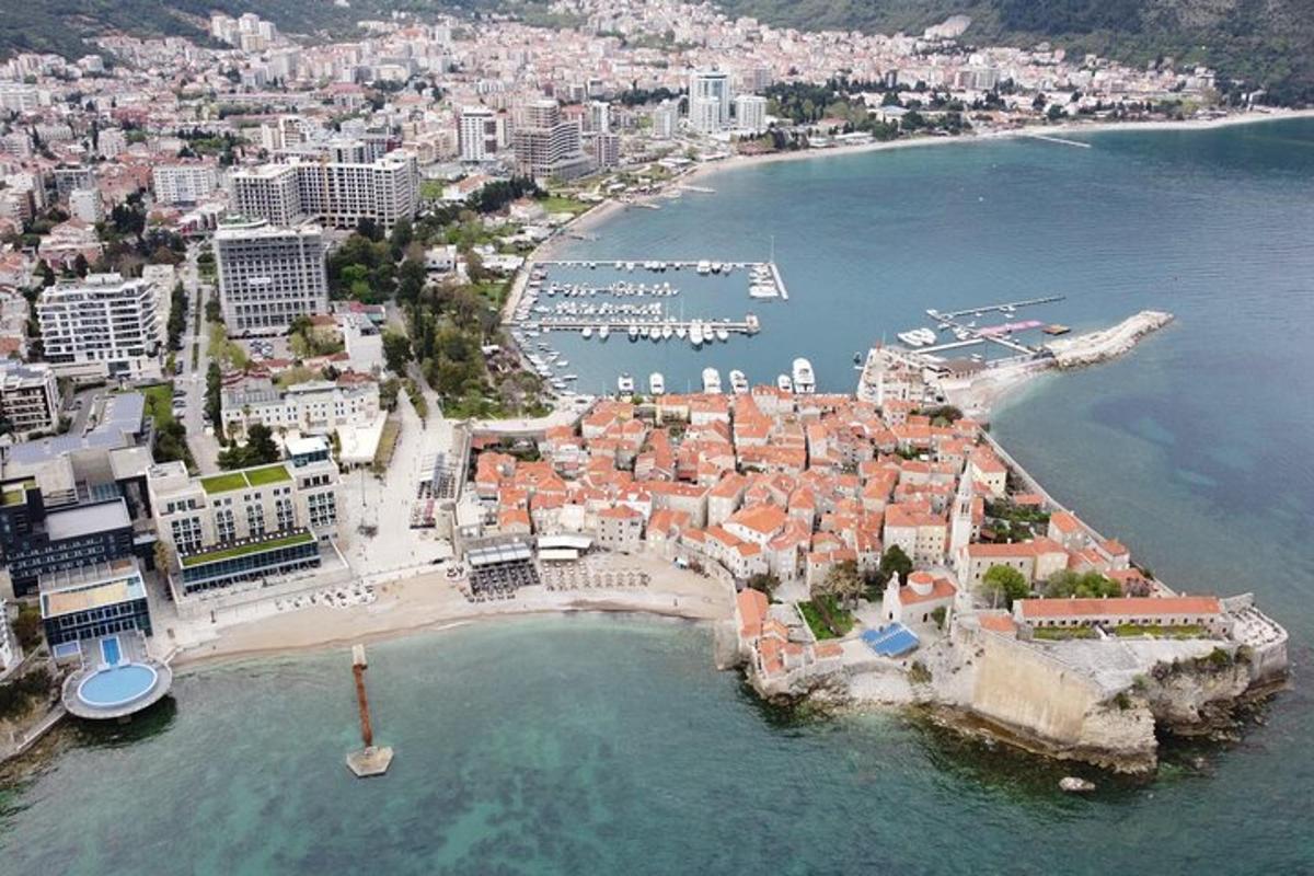 an aerial view of a city with a harbor