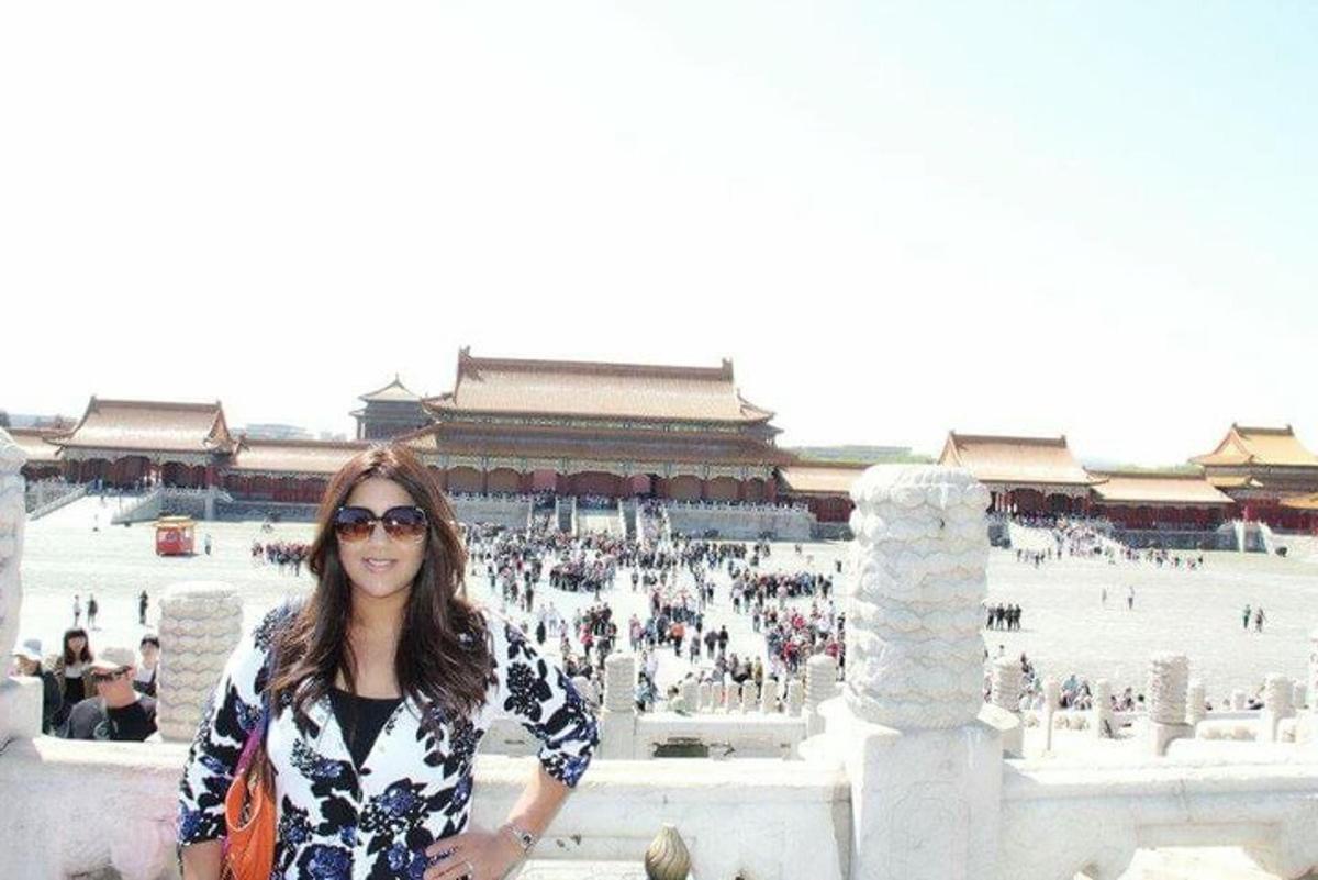a woman standing in front of a building