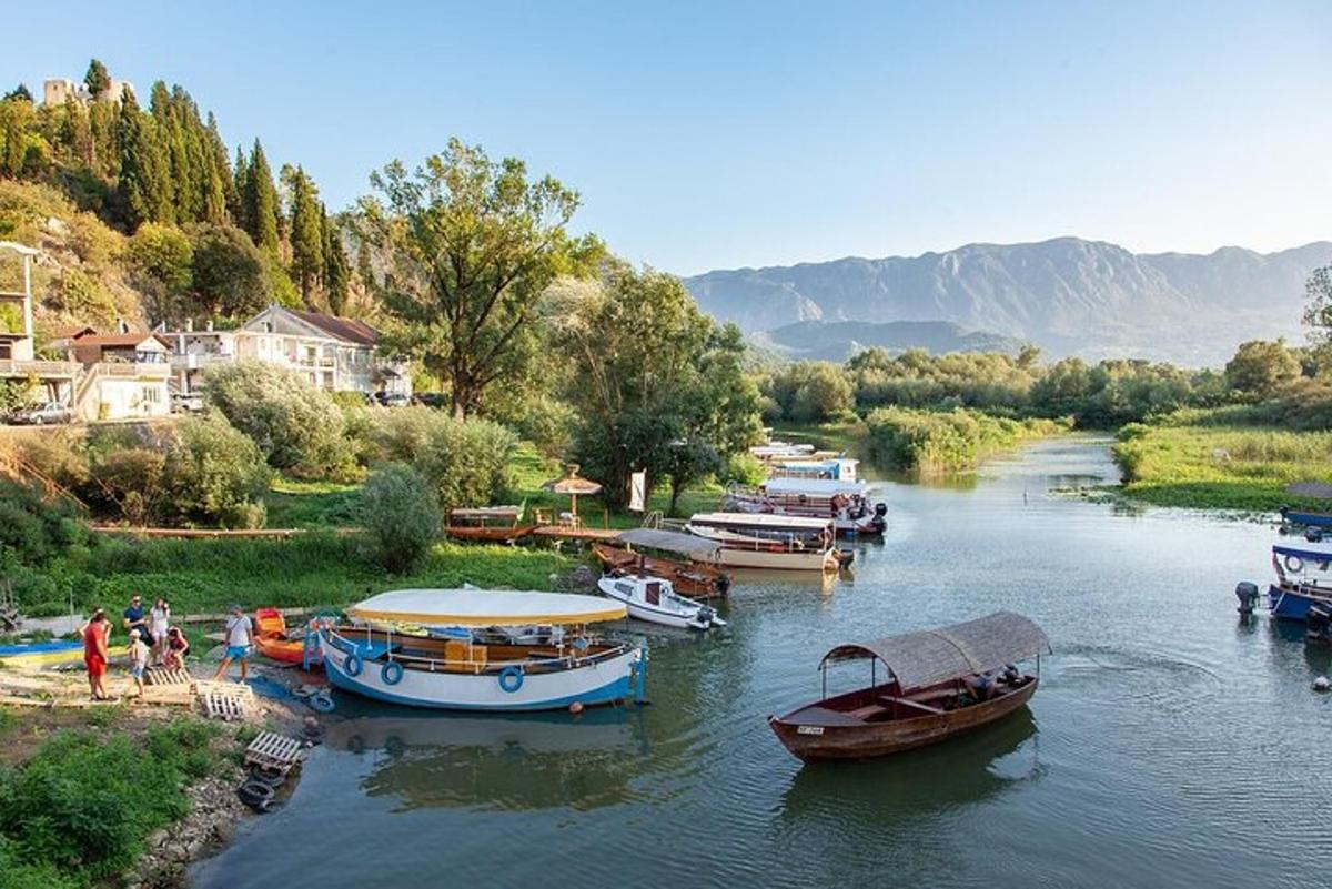 a group of boats are docked on a river