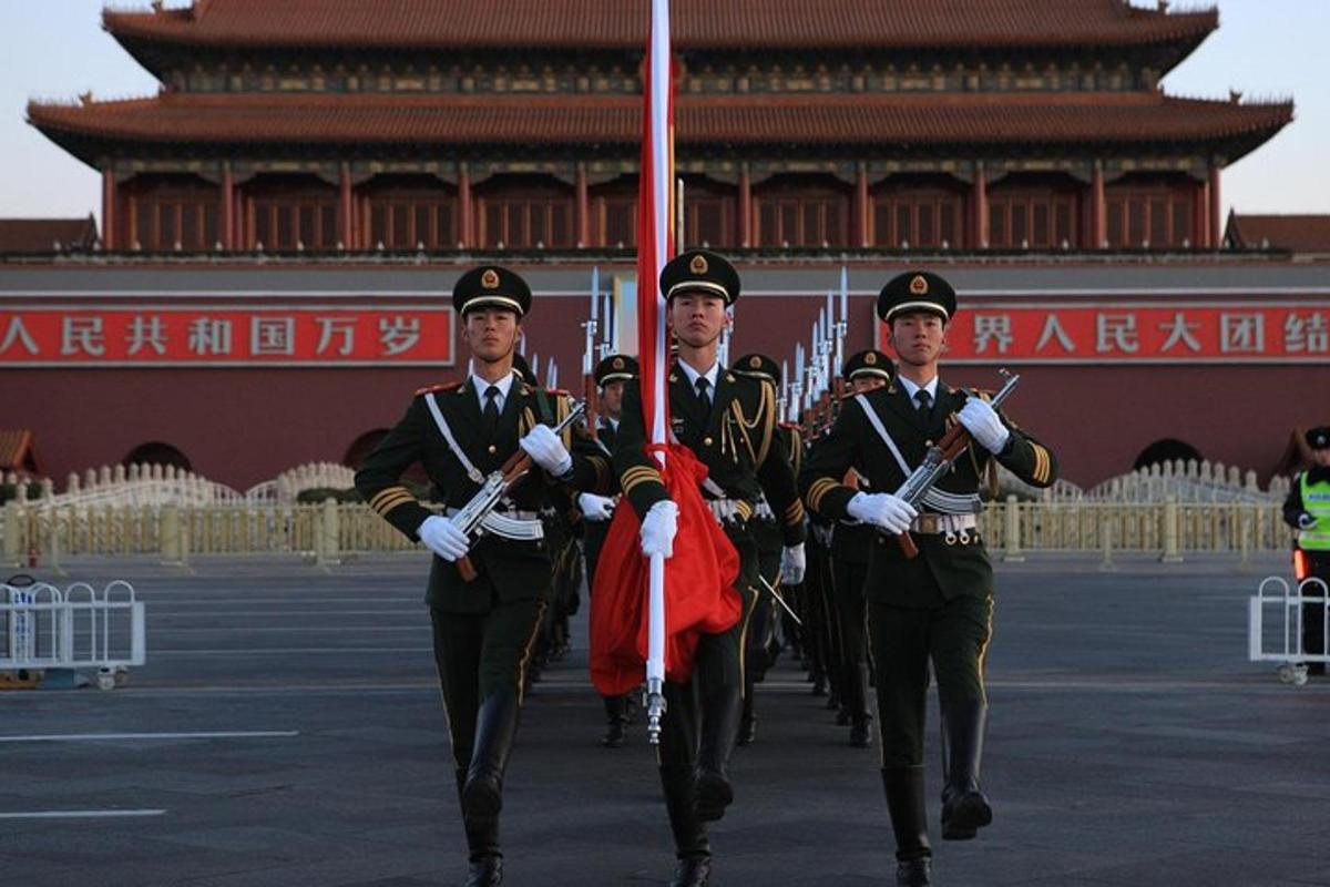 a group of men in uniform walking in front of a building