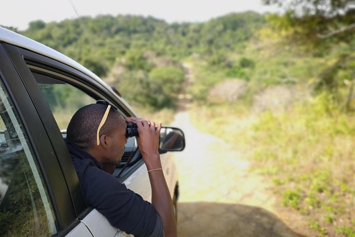 a woman taking a picture of a river from a car