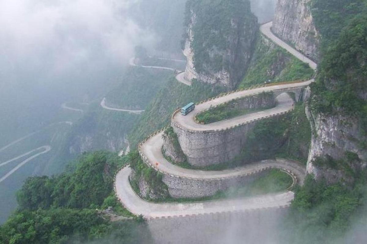 a winding road on the side of a mountain