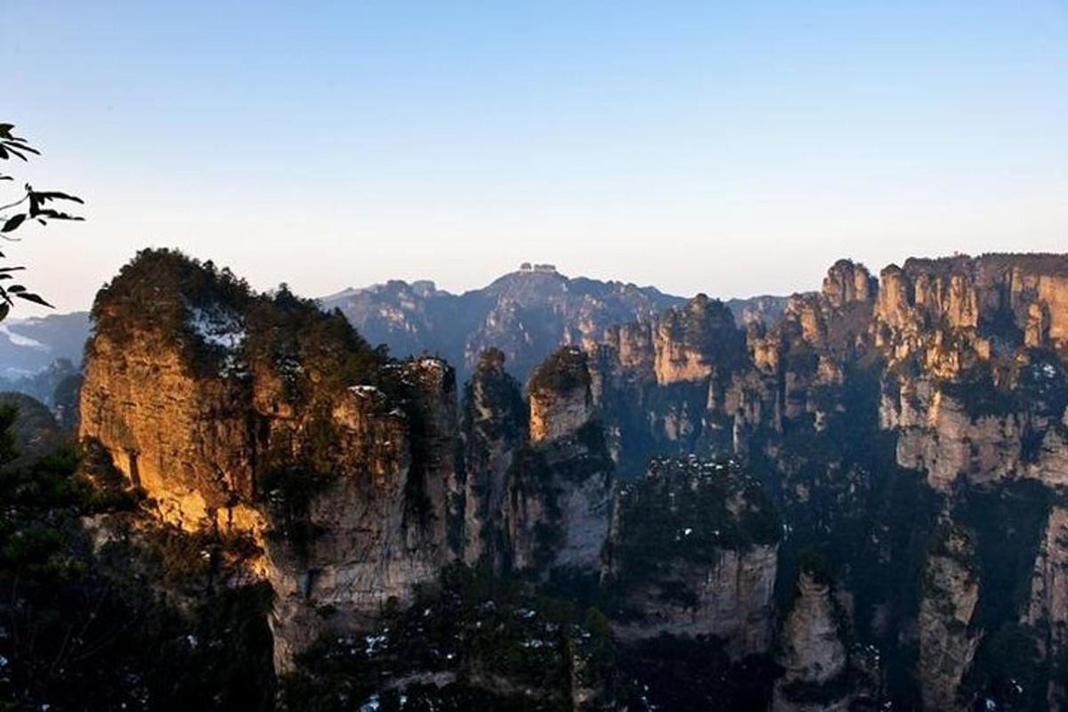 a view of a large mountain range with cliffs