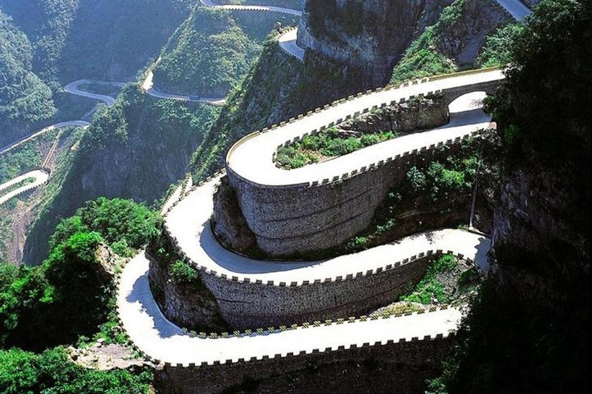 a winding road on the side of a mountain