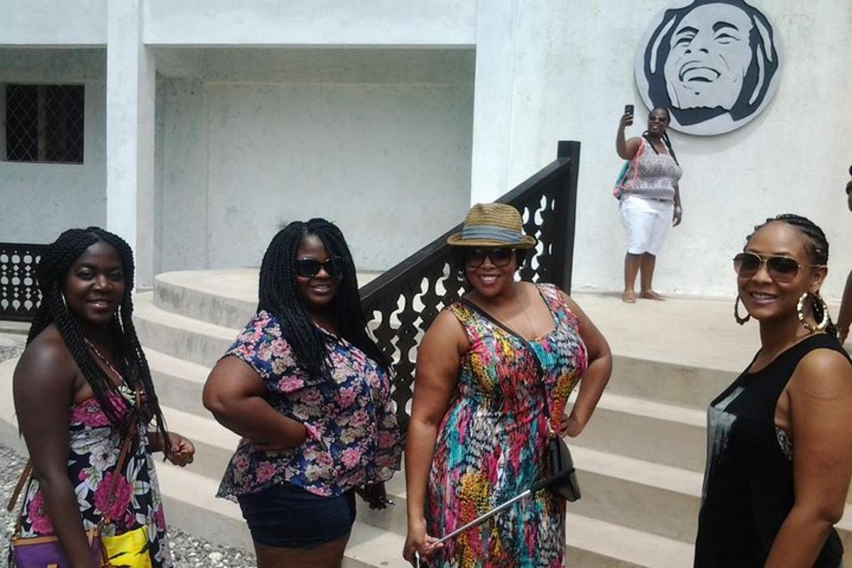 a group of women standing on the steps of a building