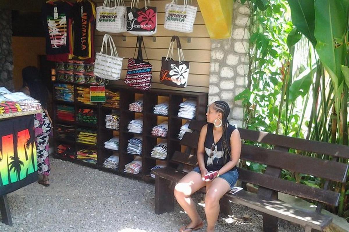 a woman sitting on a bench in front of a store