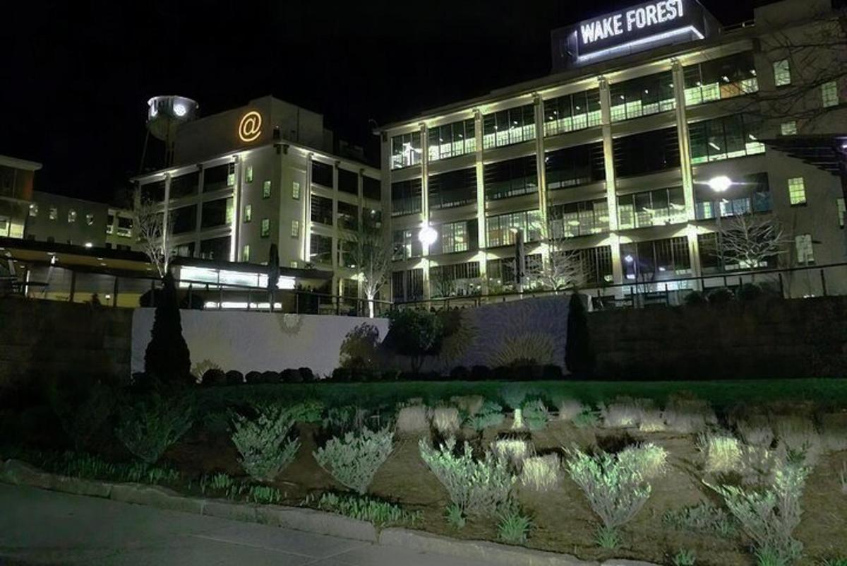 a large building with lights in front of it at night