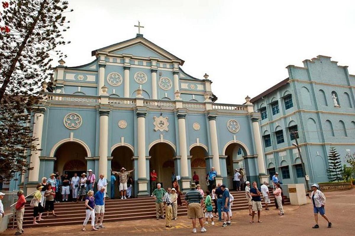 a group of people standing in front of a church