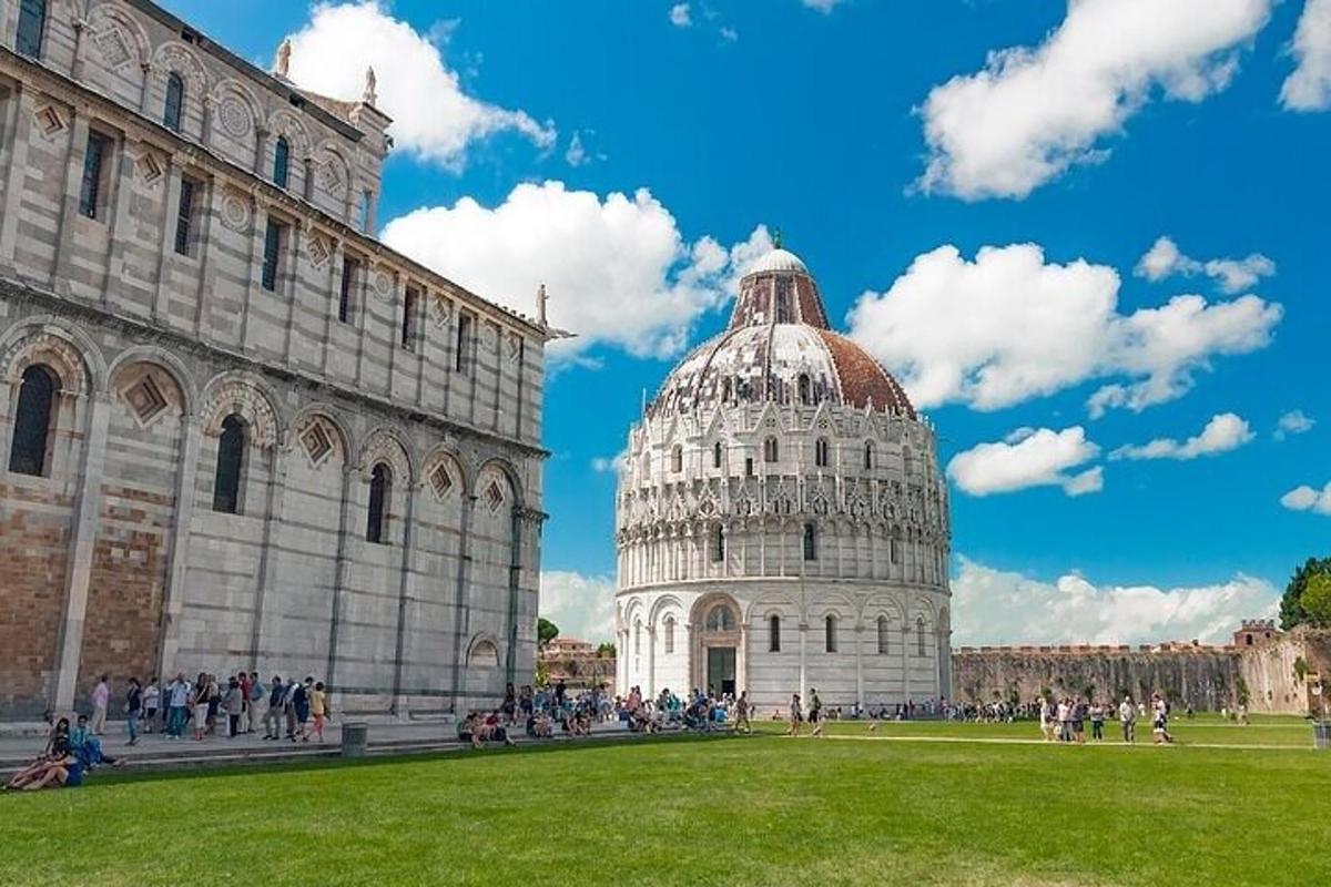 a group of people standing around the leaning tower