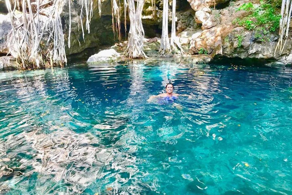 a man swimming in a pool of blue water