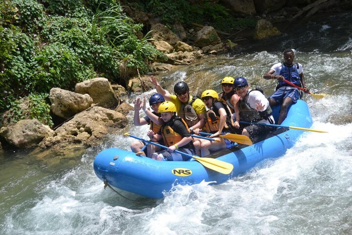 a group of people in a raft on a river