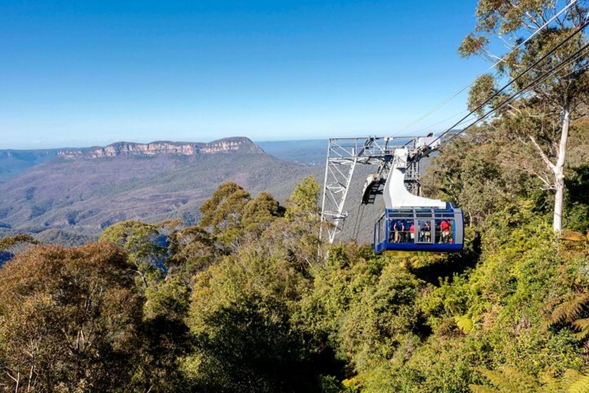 a gondola ride in the sky over the mountains