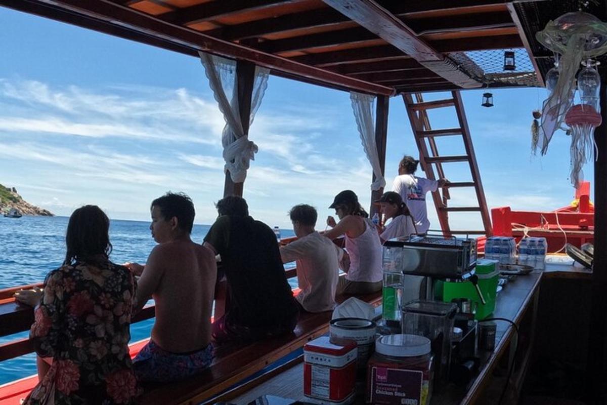 a group of people sitting at a bar on a boat