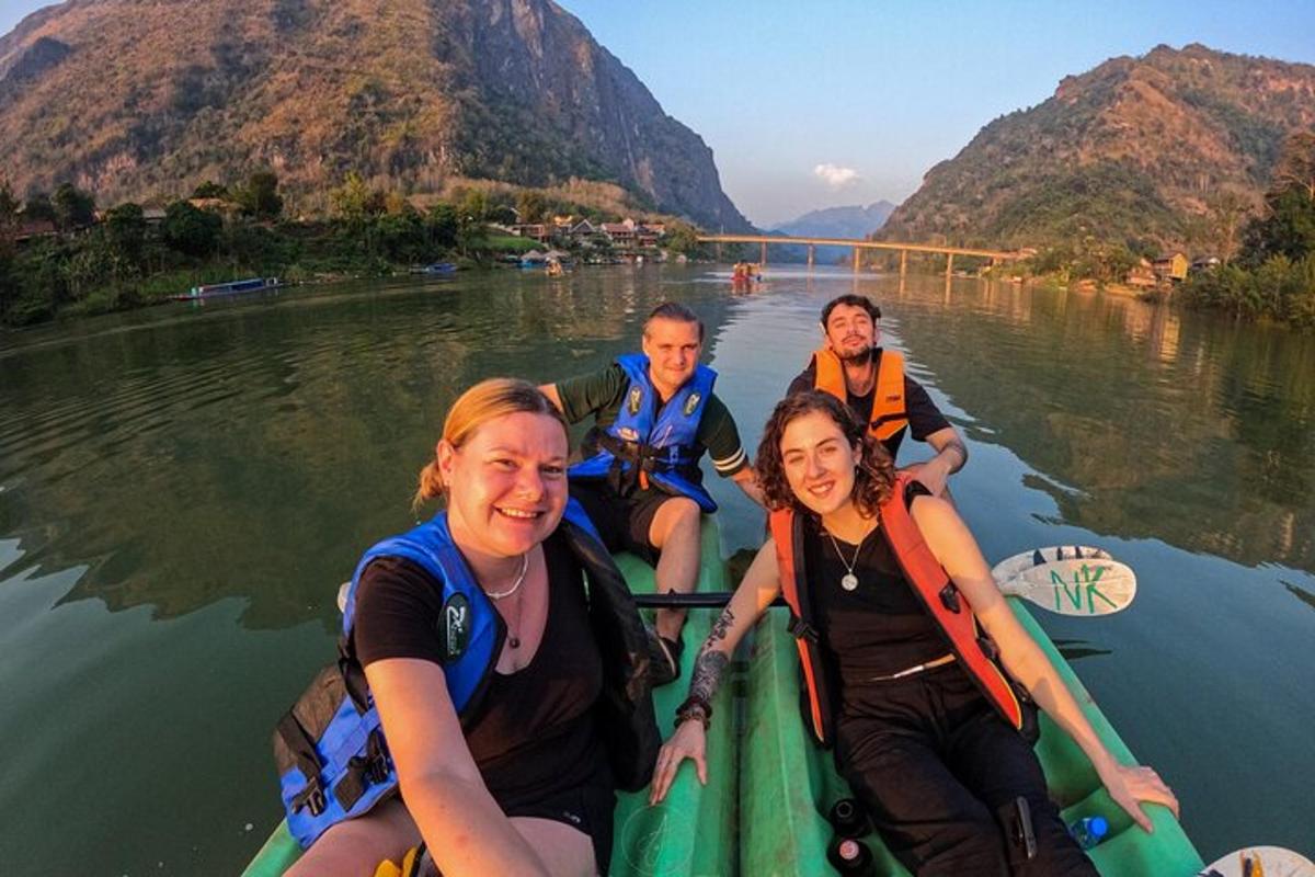 a group of people on a boat on the water