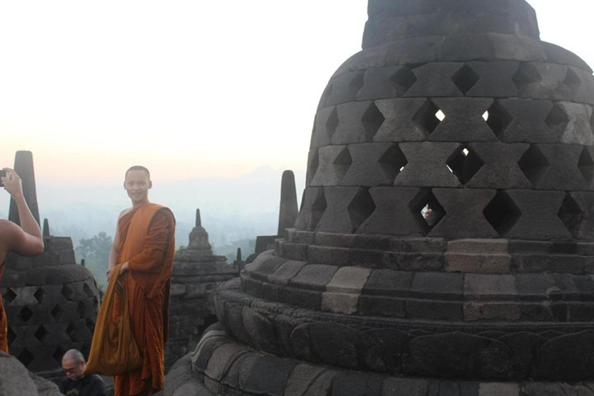 a man is standing on top of a temple