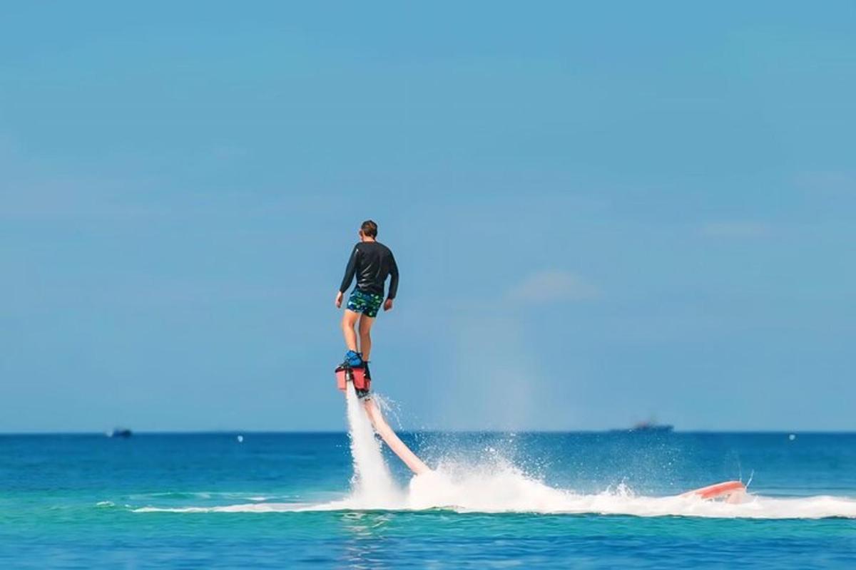 a man on a wake board in the water