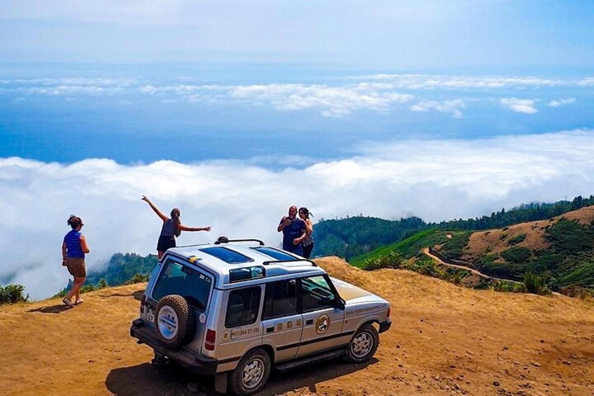 a group of people standing on top of a mountain