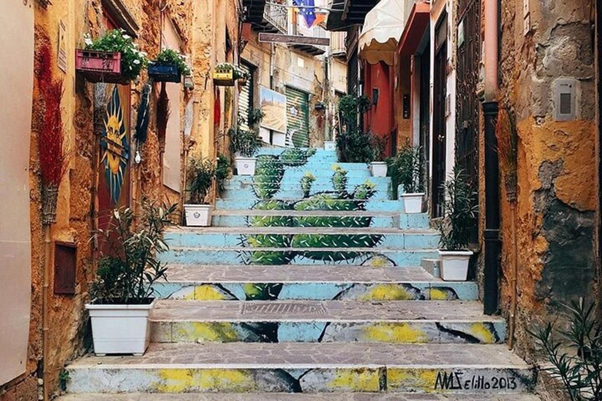 a group of stairs with potted plants on them
