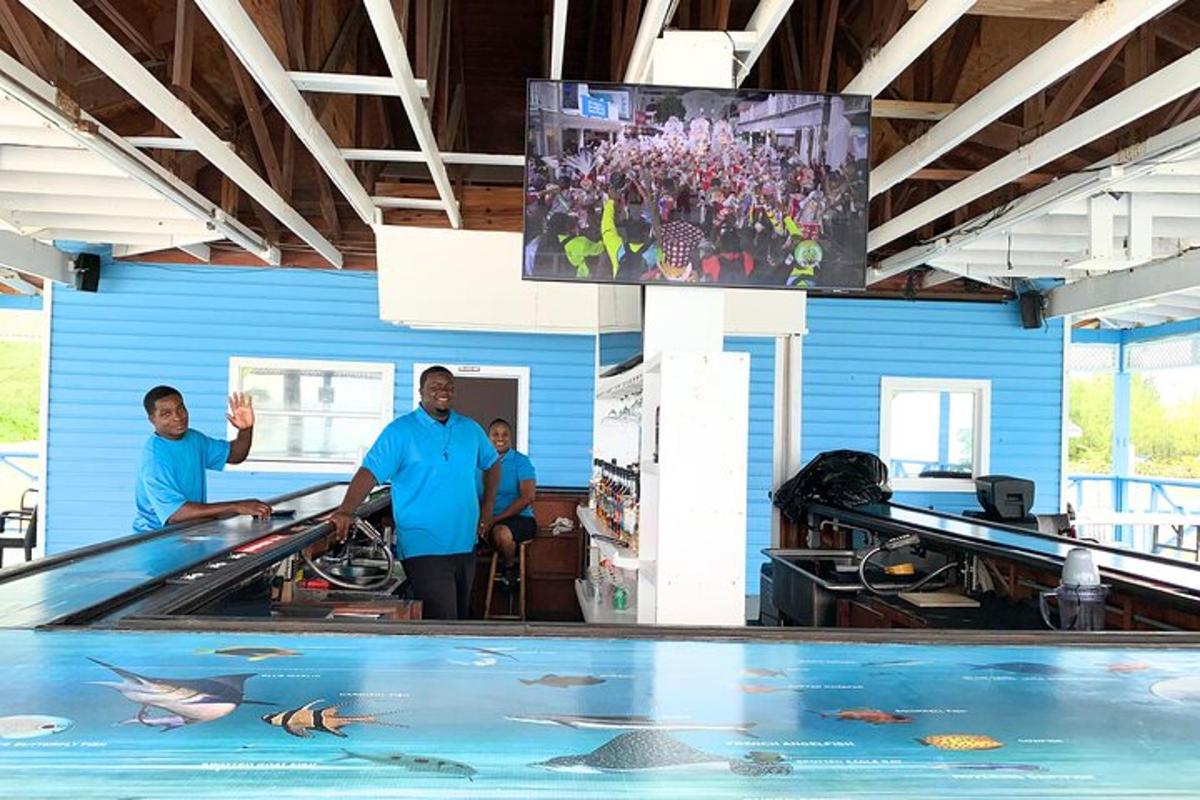 a group of men standing in a fish aquarium