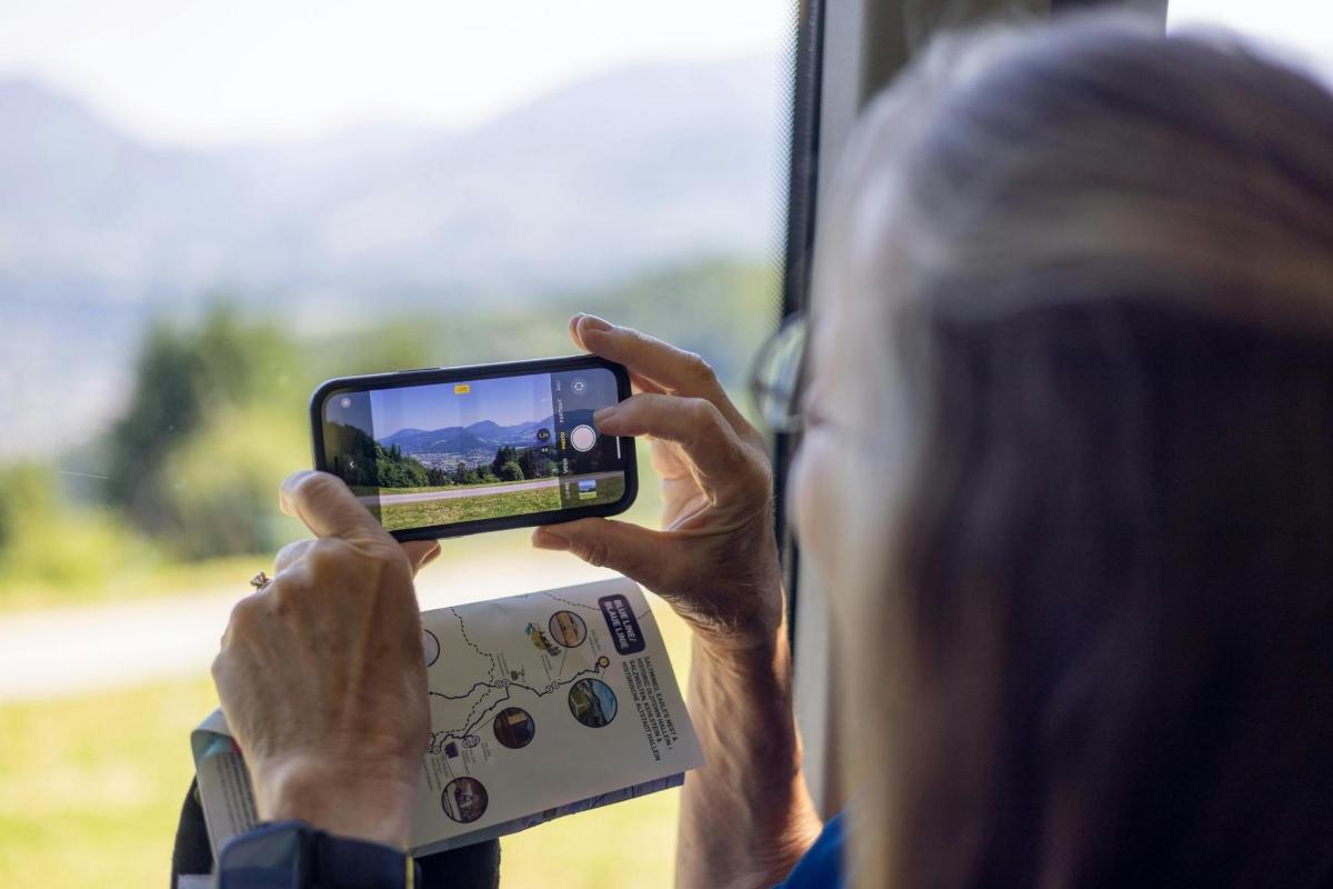 a woman taking a picture with her cell phone