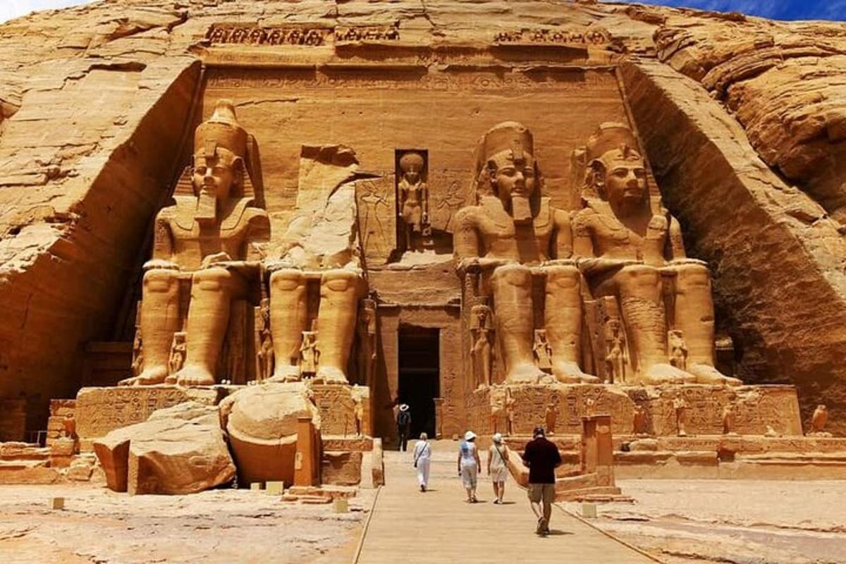 a group of people walking in front of a large building
