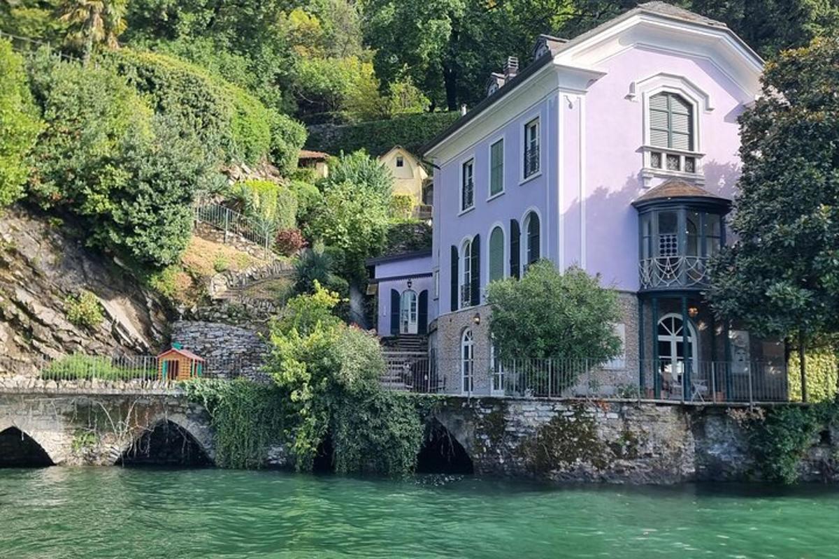 a house on a bridge next to a river