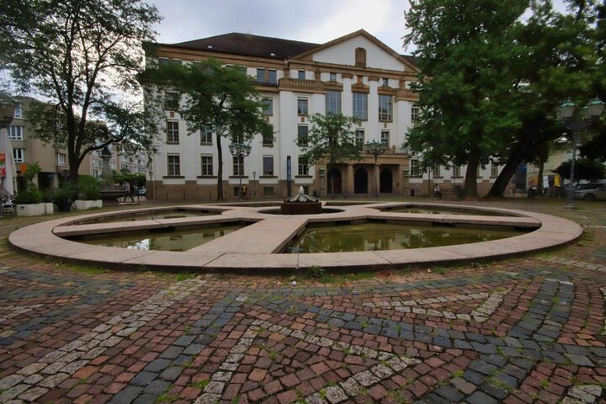 a building with a fountain in the middle of a courtyard