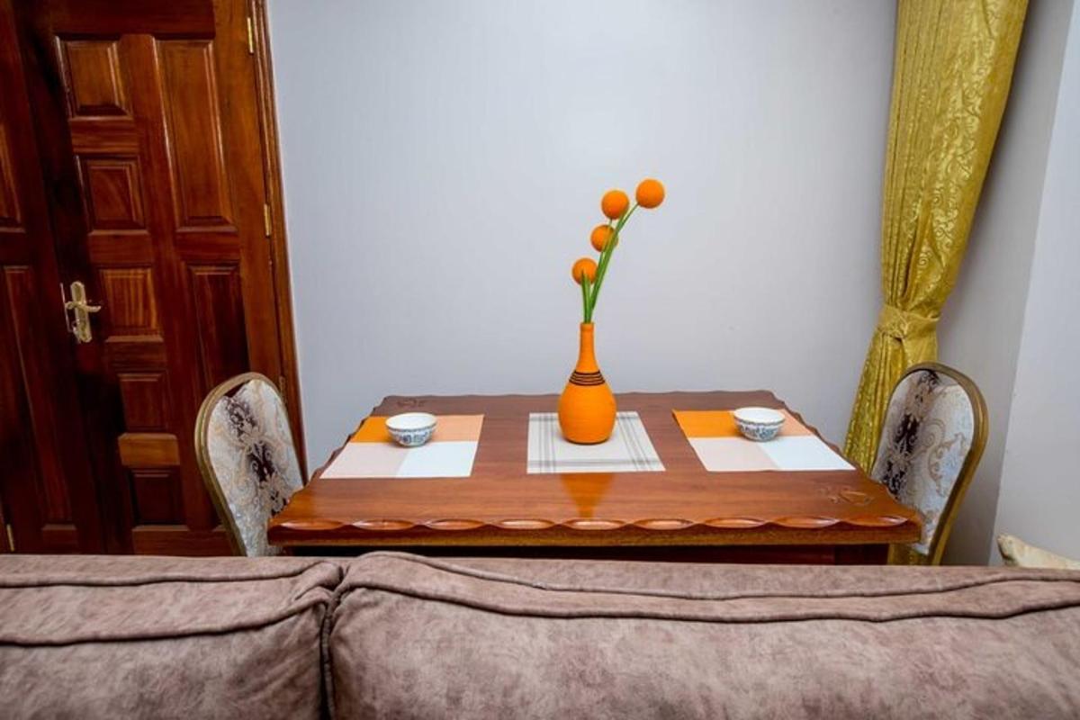 a wooden table with a vase with flowers in it