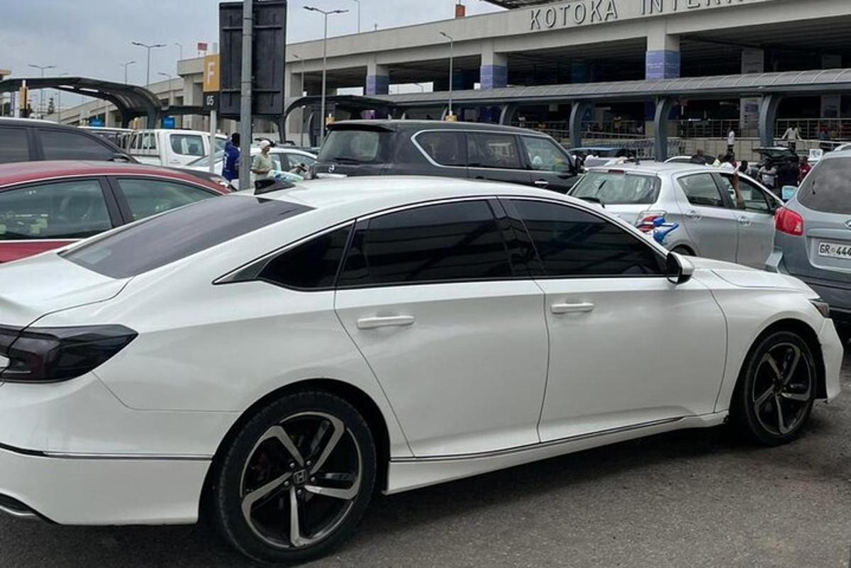a white car parked in a parking lot