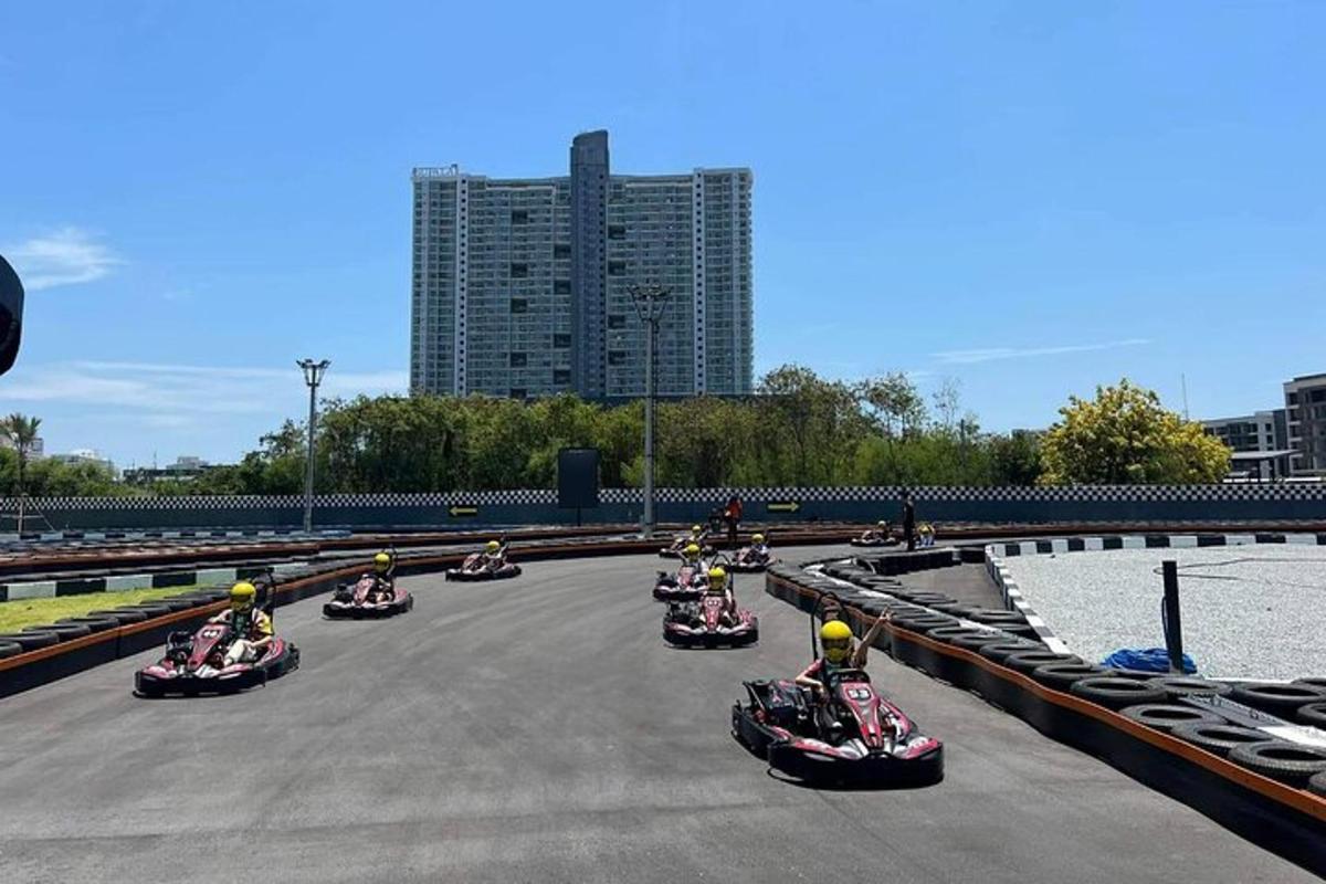 a group of people riding motorcycles on a race track