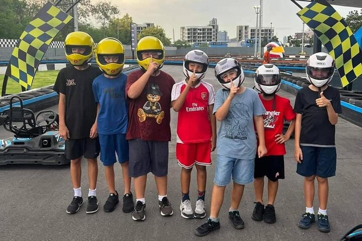 a group of boys wearing helmets and posing for a picture