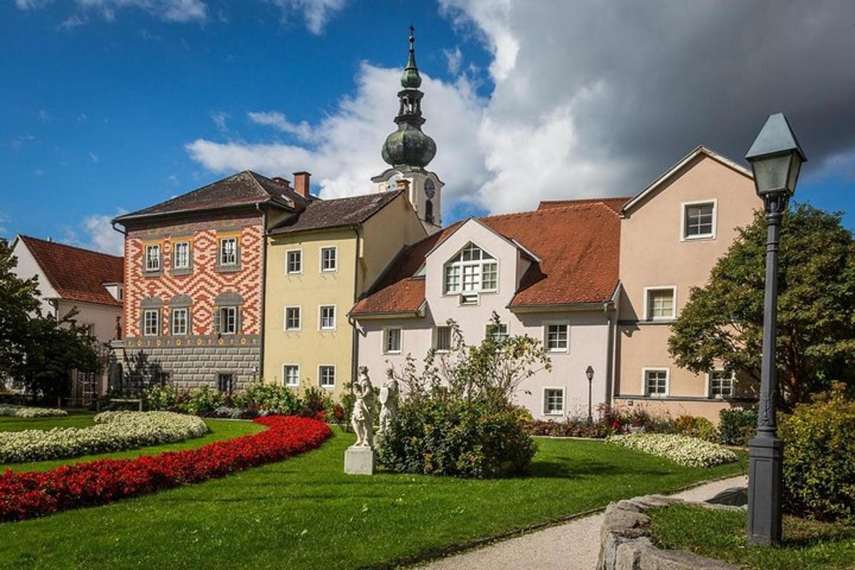 a large building with a garden in front of it