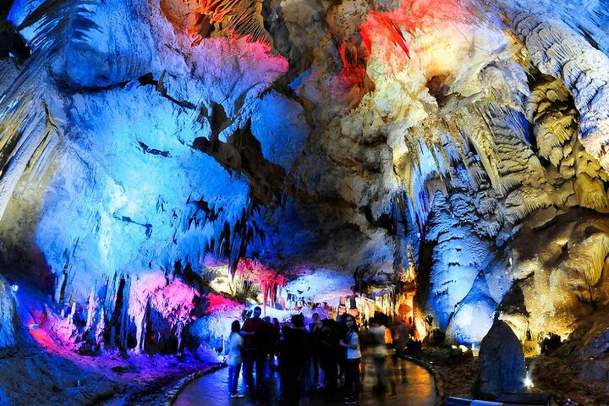 a group of people standing in a cave