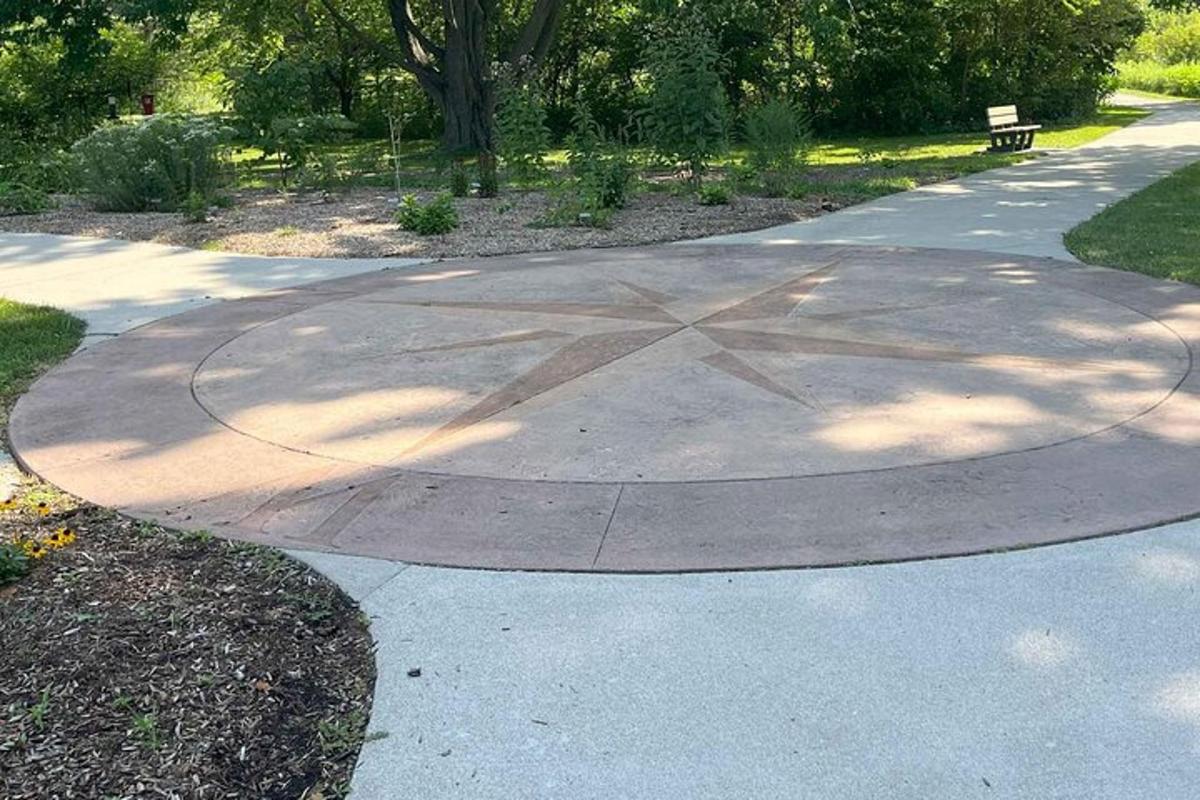 a skate park with a star on the sidewalk