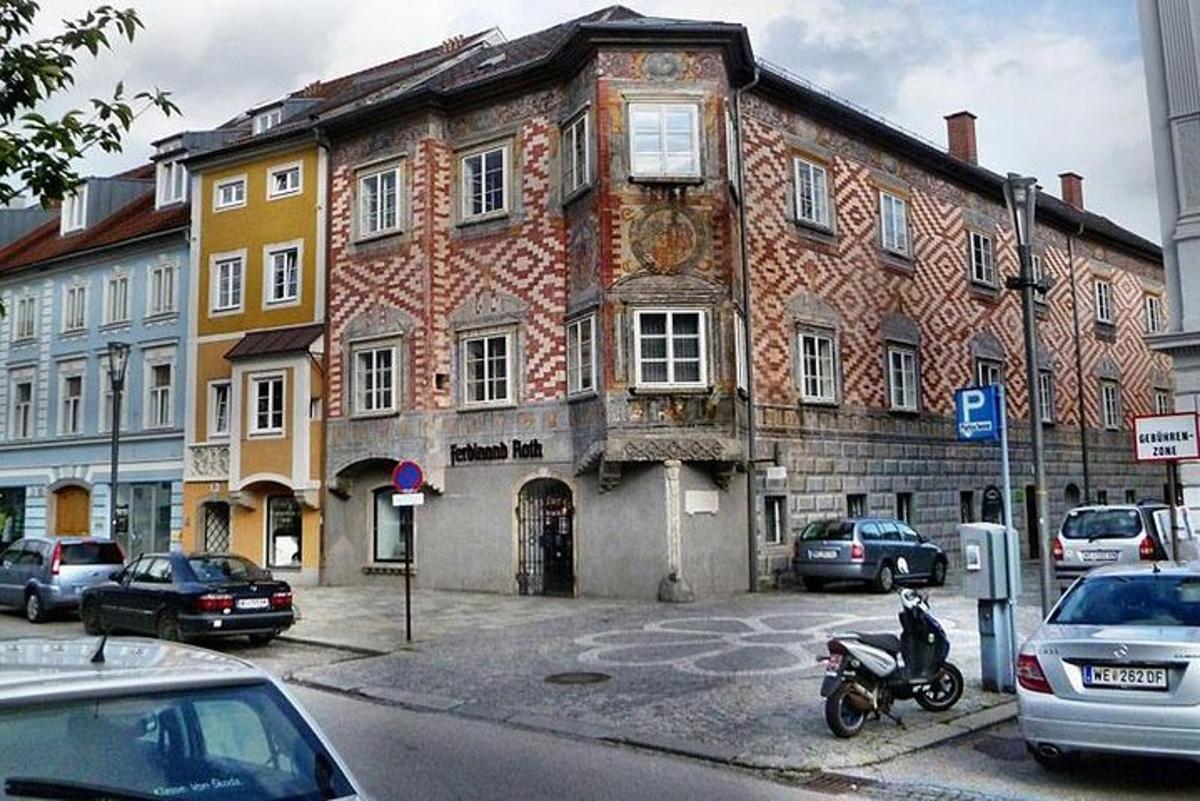 an old building with a motorcycle parked in front of it