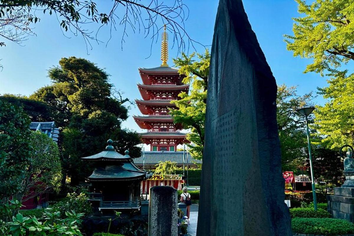 a tall building with a pagoda in the background