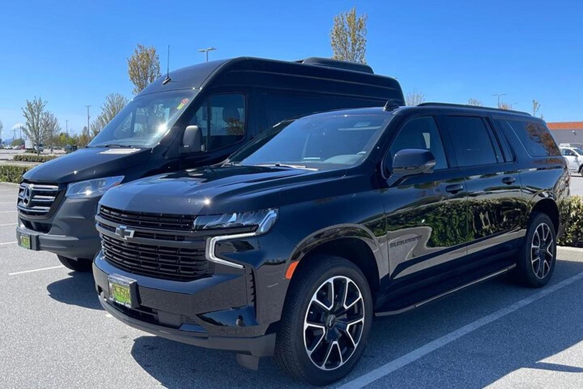 a black truck parked in a parking lot