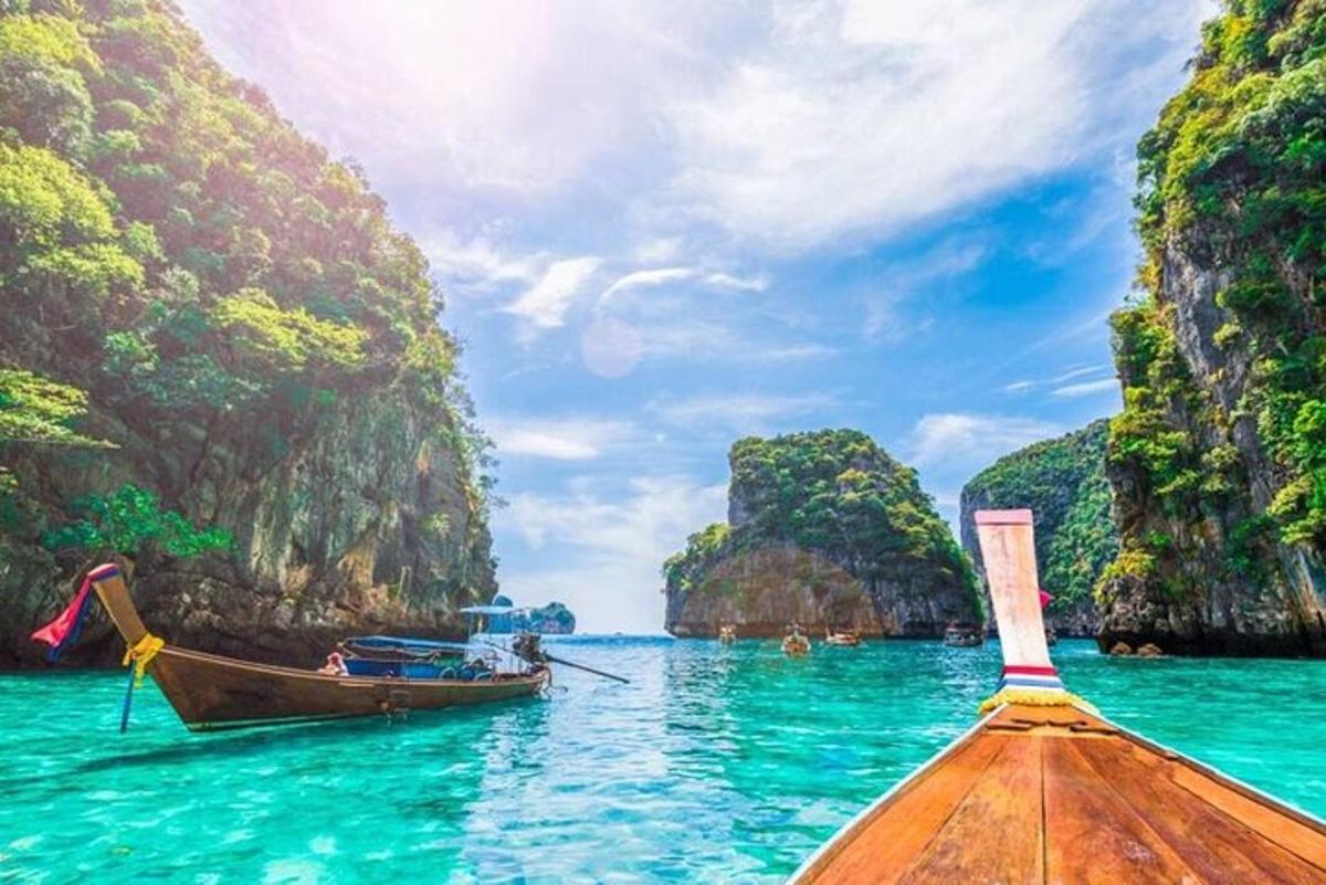 a boat in the water next to a beach