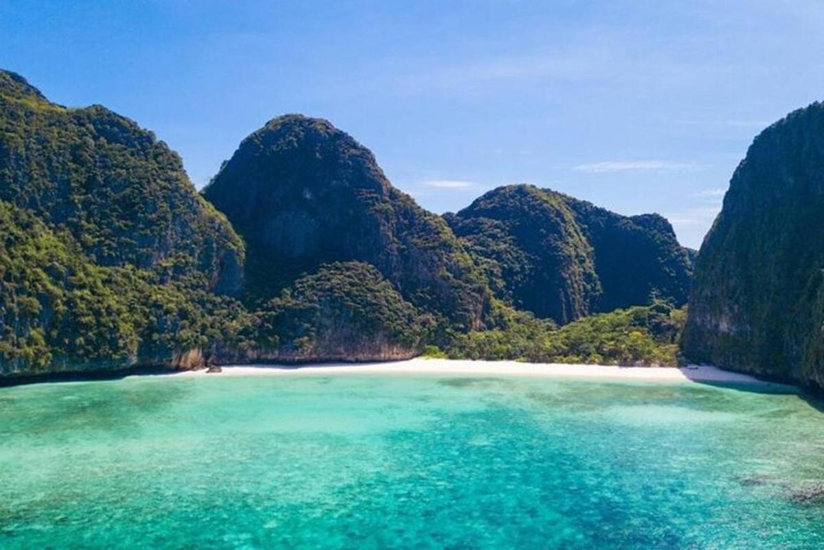 a view of a beach with mountains in the background