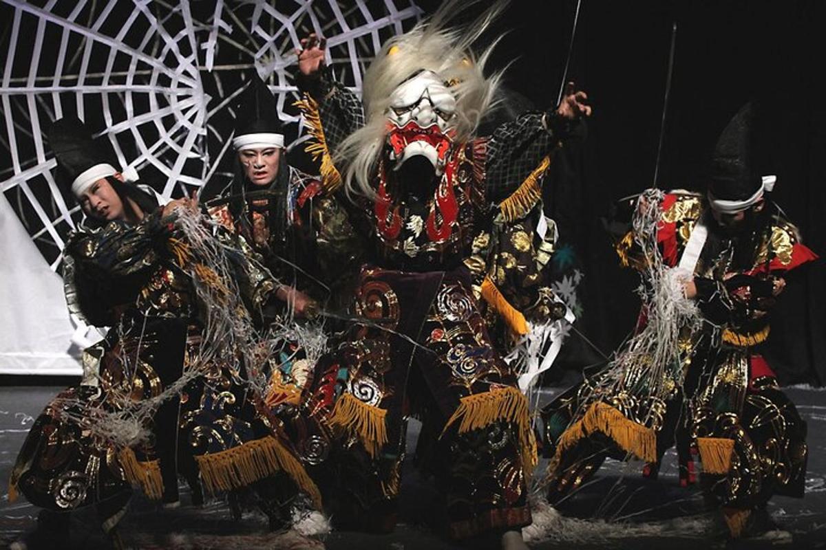 a group of people in costumes on a stage