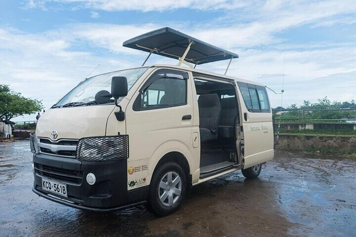 a white van with its door open with a roofrack