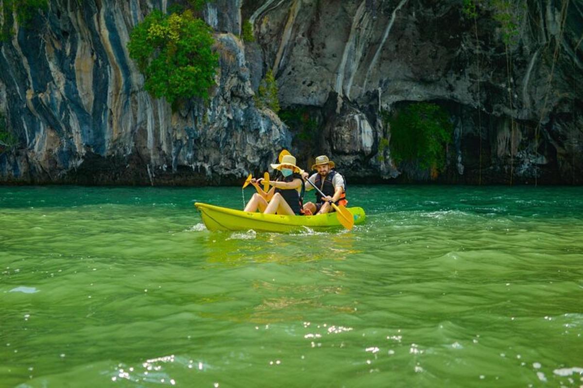 two people in a yellow boat in the water